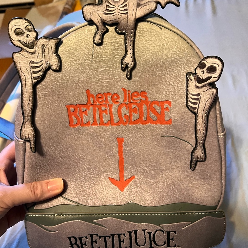 Loungefly Gray and Red Beetlejuice Backpack glow in the dark